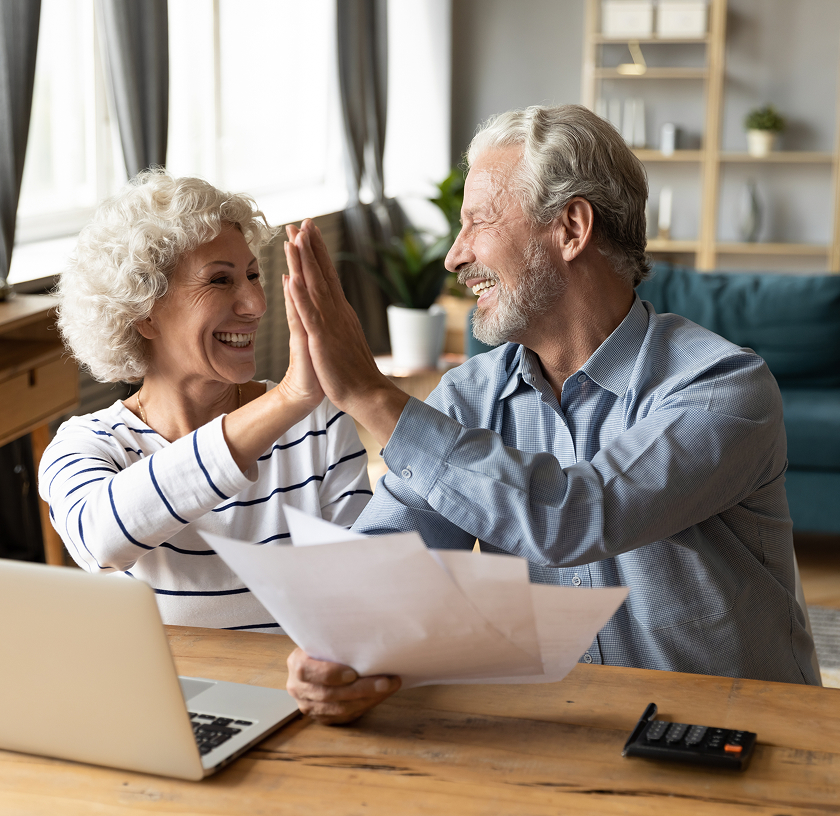 older couple high fiving