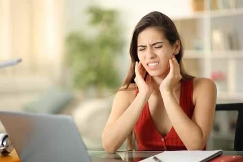 stressed woman with TMJ issues